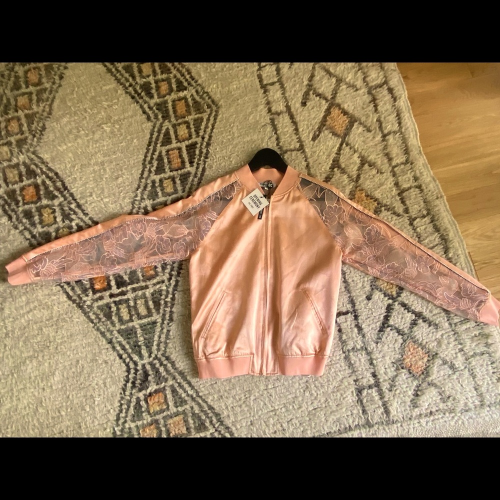 Peach color, silk and lace, track suit style jacket. Opening ceremony